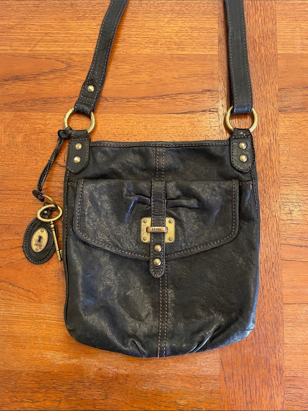 Fossil Black Leather Front-Flap Crossbody with Cool brass  lock and key detail.